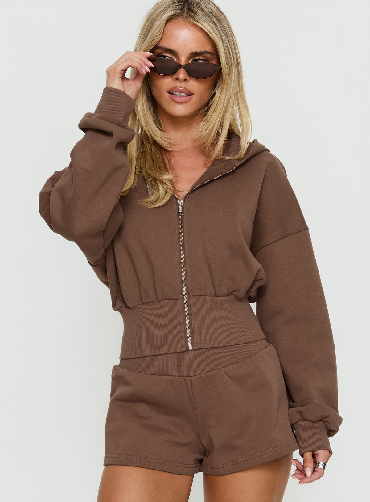 Featuring the Daytime Cropped Blouson Hoodie Cocoa womens-jumpers with short length detail view of model wearing Princess Polly
