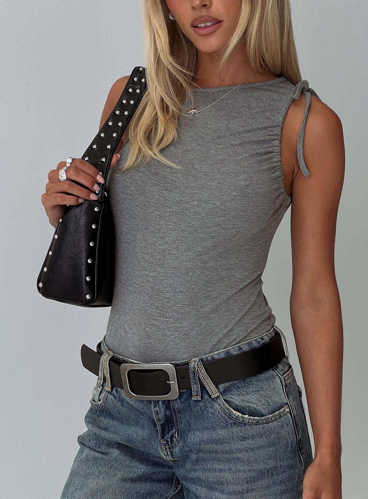 side view of model wearing Princess Polly Magnetism Bodysuit Grey Sleeveless Bodysuit 