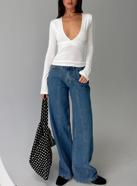 front view of model wearing Princess Polly Lando Low Rise Straight Leg Jeans Mid Blue Wash Mid Rise Jeans Jeans 