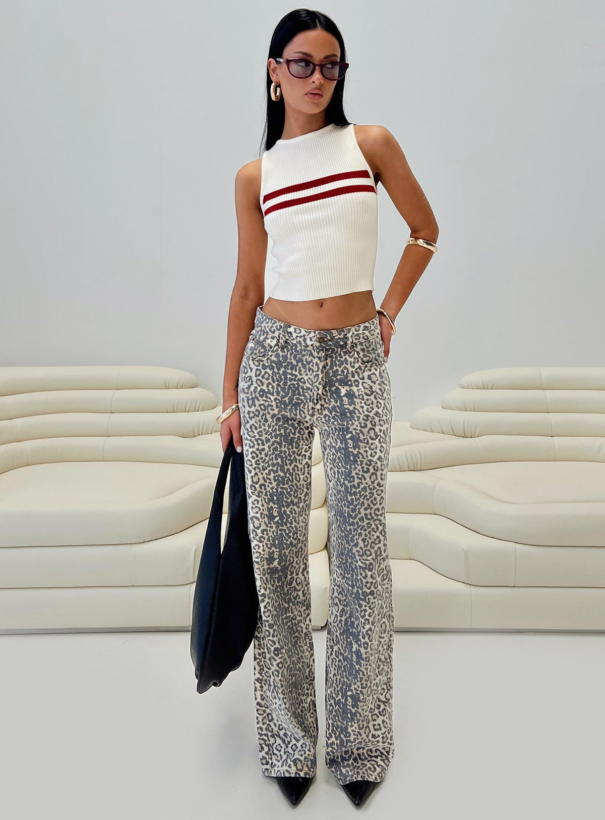 front view of model wearing Princess Polly Top Model Low Rise Straight Leg Jeans Leopard Fade Mid Rise Jeans Jeans 