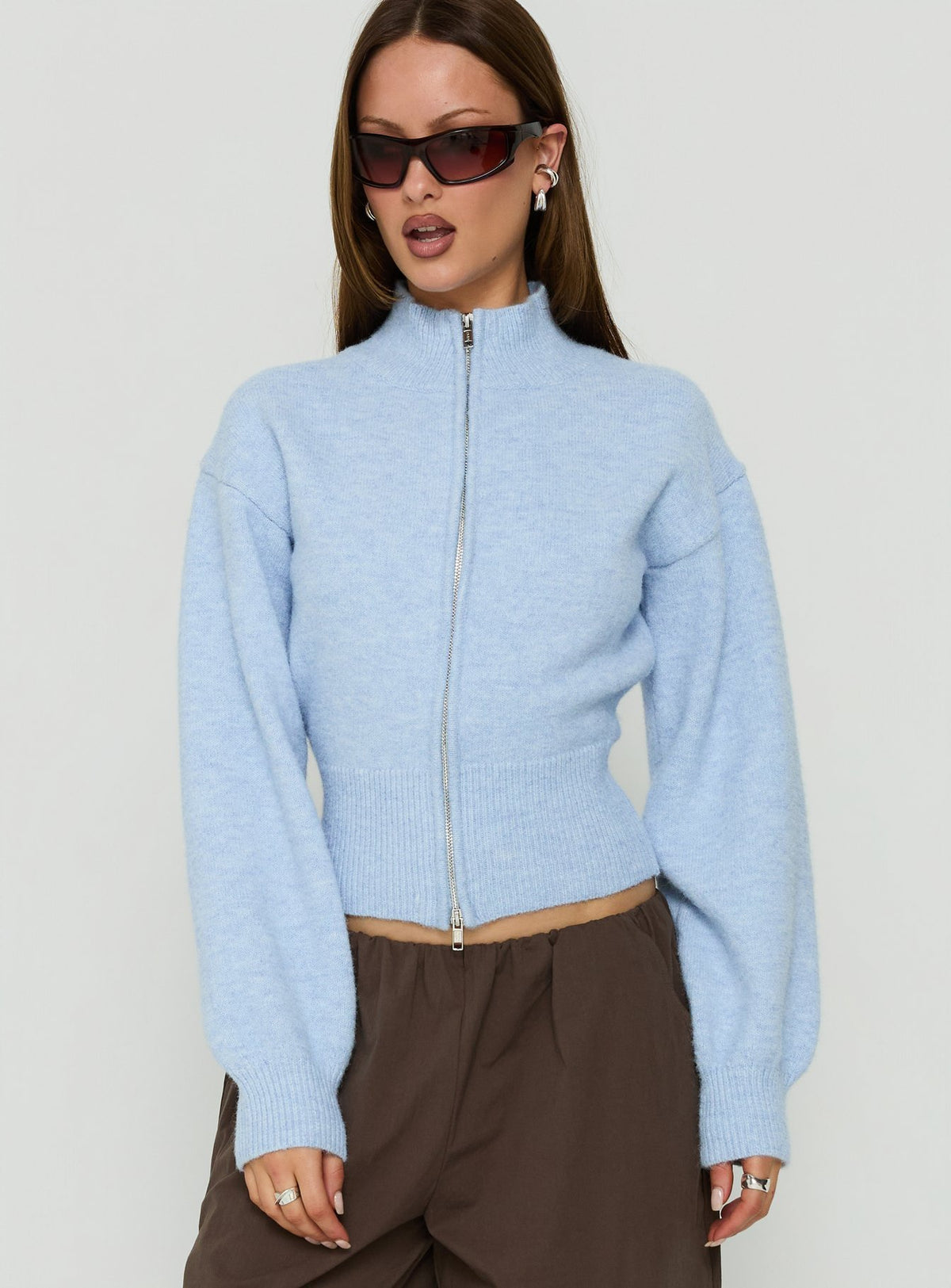 Showcasing the Agneta Zip Through Funnel Neck Sweater Blue womens-jumpers with short length front view of model wearing Princess Polly