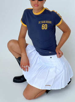   side view of model wearing Princess Polly UCSD Tennis Skort White Skirts 