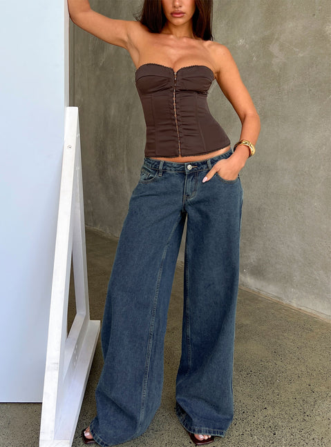Showcasing the Picco Ultra Low Rise Wide Leg Jeans Dark Blue Wash Petite in womens-jeans with low-rise waist front view of model wearing Princess Polly