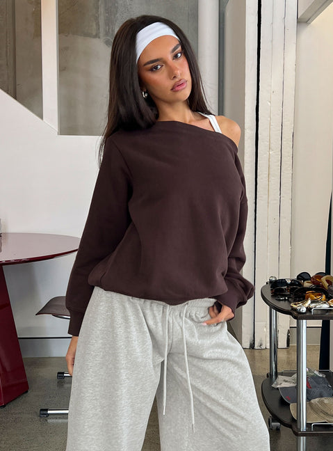 Showcasing the Wellness Off The Shoulder Jumper Brown in women's jumpers with long length and oversized fit front view of model wearing Princess Polly