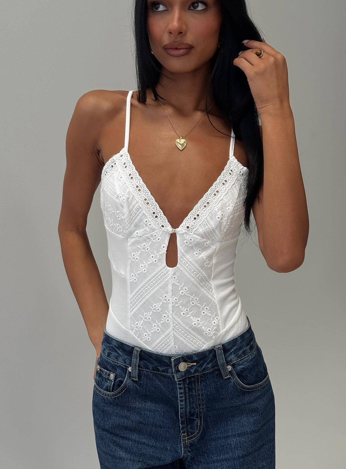 front view of model wearing Princess Polly Nerisse Keyhole Bodysuit White Sleeveless Bodysuit 