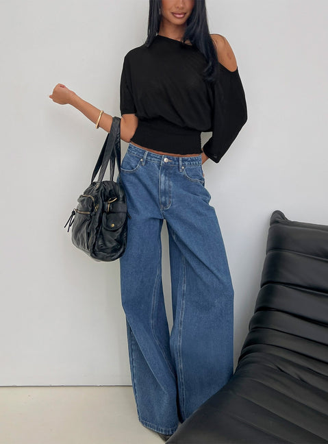side view of model wearing Princess Polly Naylor Mid Rise Wide Leg Jeans Mid Blue Wash Mid Rise Jeans Jeans 