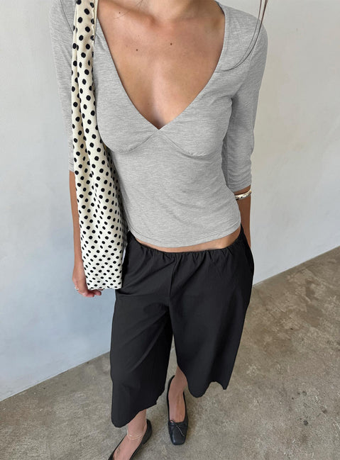 Featuring the Lunea Concealed Waistband 3/4 Pant Black Petite in womens-regular-pants with high-rise front view of model wearing Princess Polly