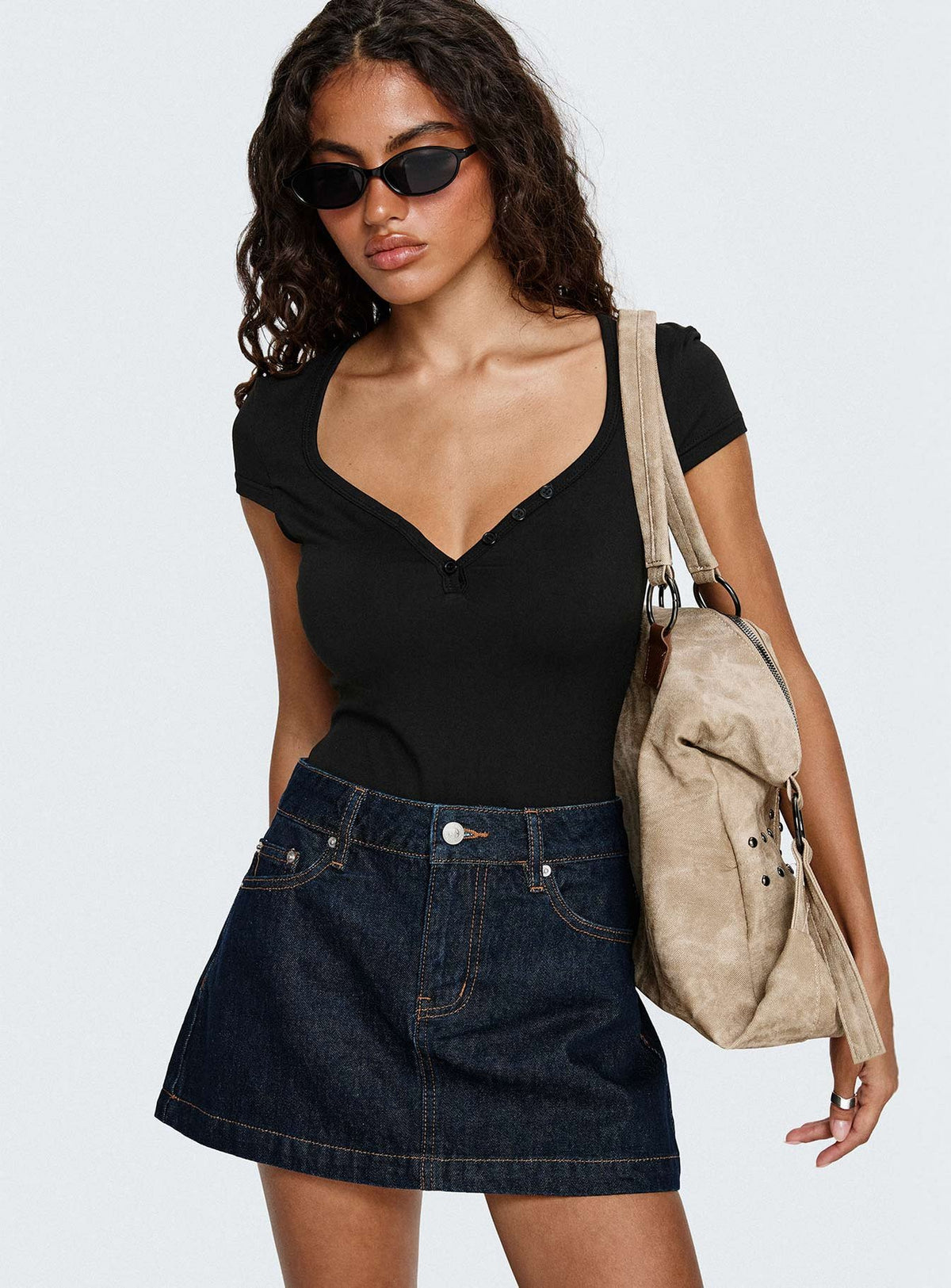   front view of model wearing Princess Polly Nicolina Low Rise Denim Mini Skirt Raw Denim Mini Skirts Skirts 