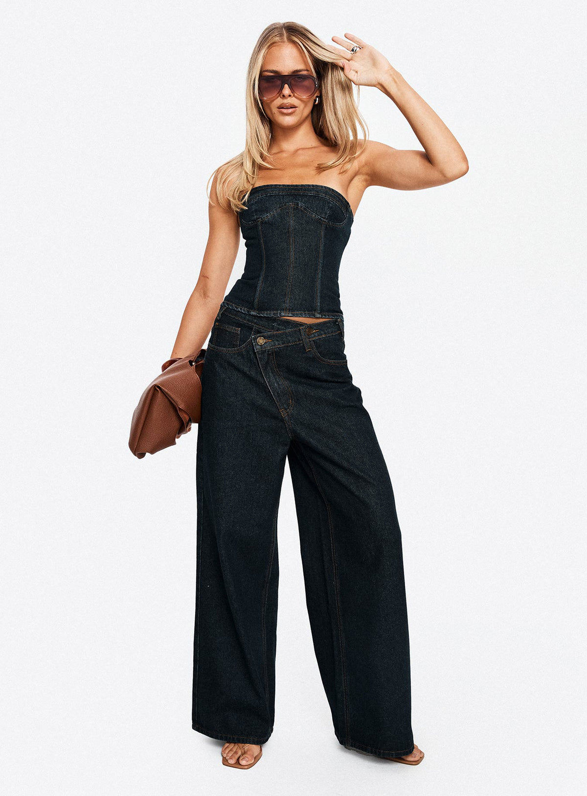 front view of model wearing Princess Polly Blue Crush Low Rise Wide Leg Jeans Indigo Mid Rise Jeans Jeans 