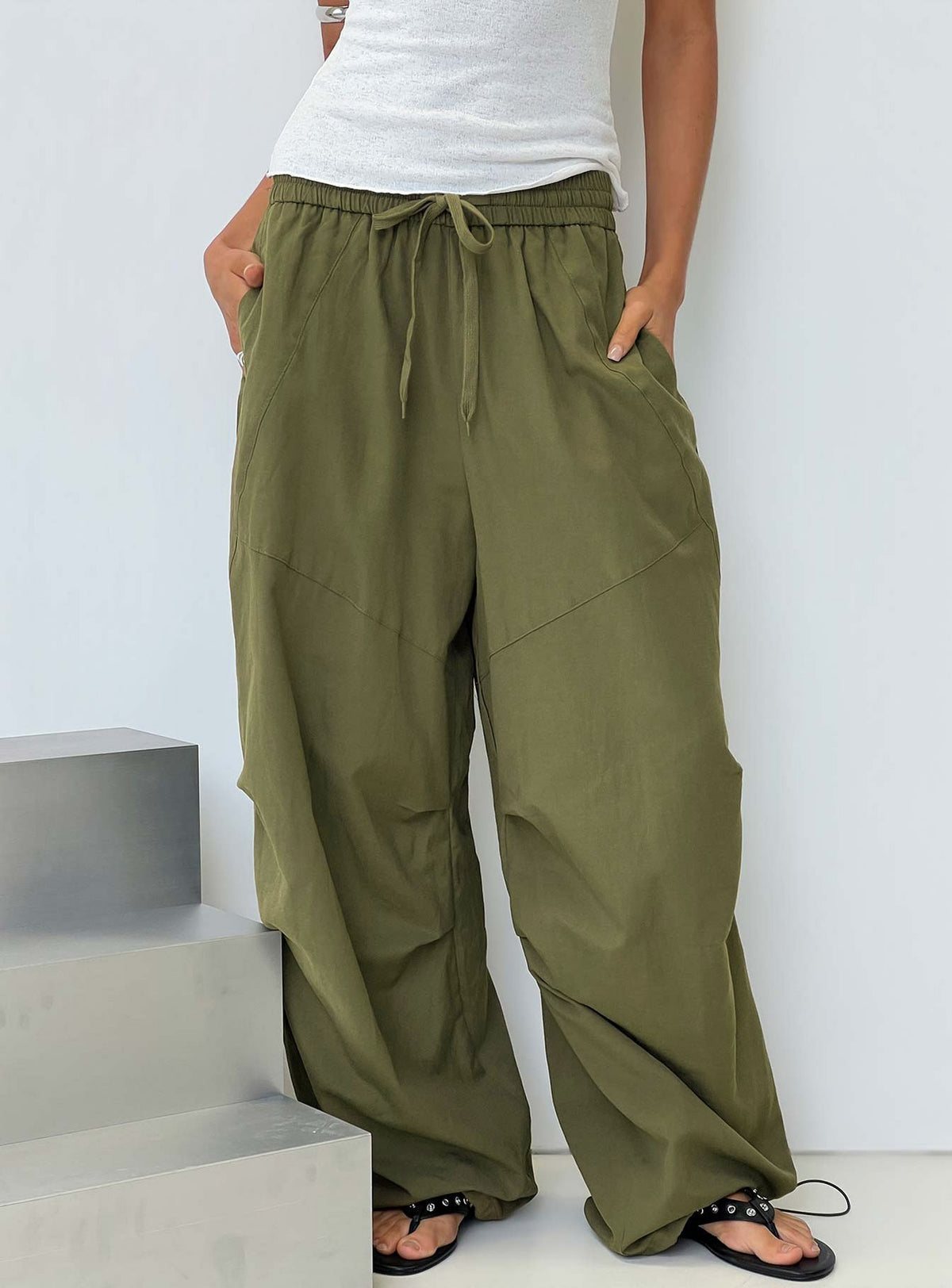 Discover the Mankind Baggy Cargo Pants Olive in womens-regular-pants with mid-rise waist front view of model wearing Princess Polly