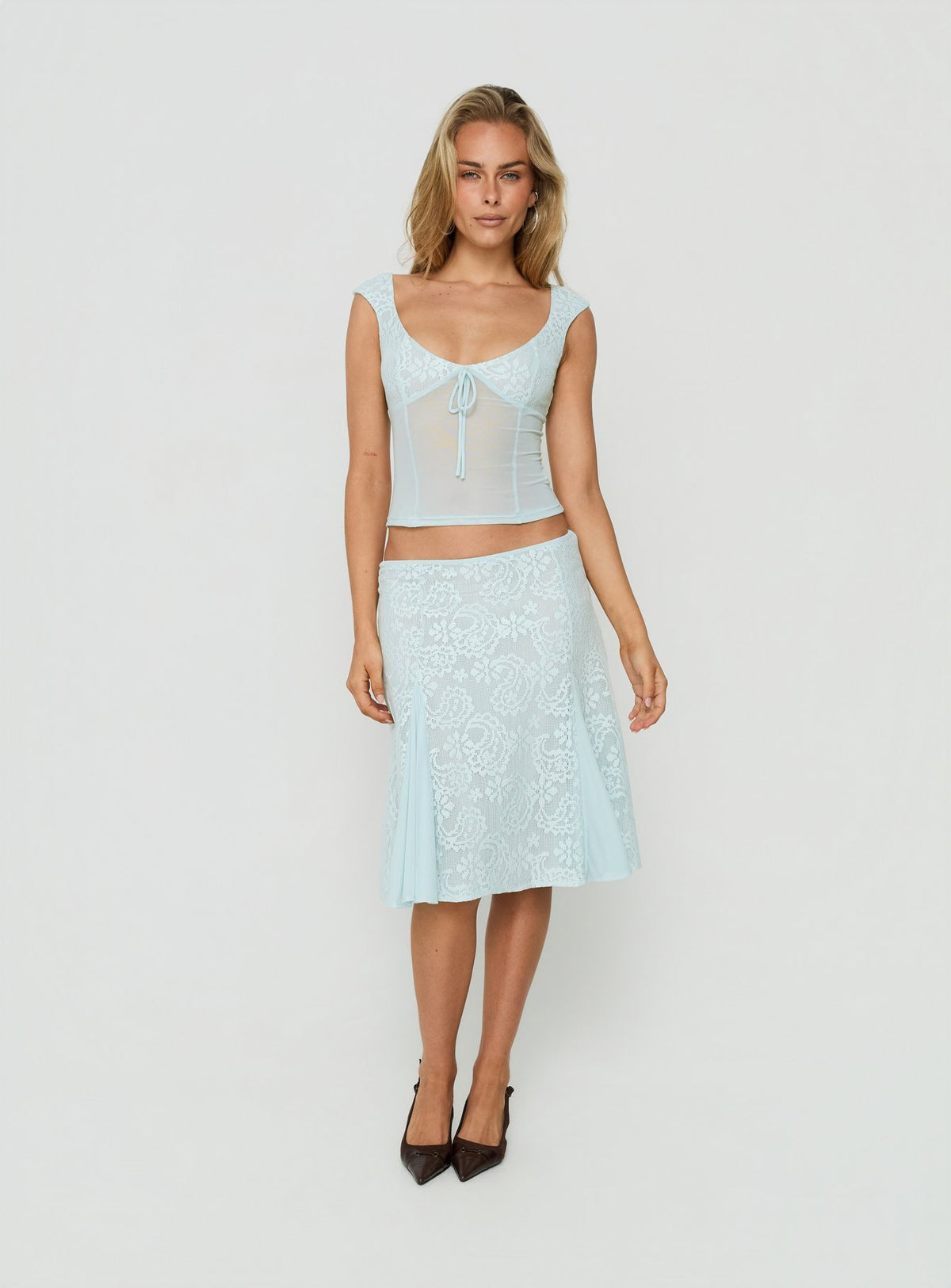 Showcasing the Quani Lace Midi Skirt Blue in womens-skirts with fitted aline silhouette front view of model wearing Princess Polly