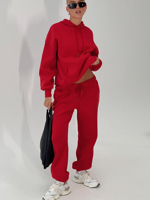 side view of model wearing Princess Polly Dream Fleece Ankle Cuff Sweatpants Red High Rise Pants Pants 