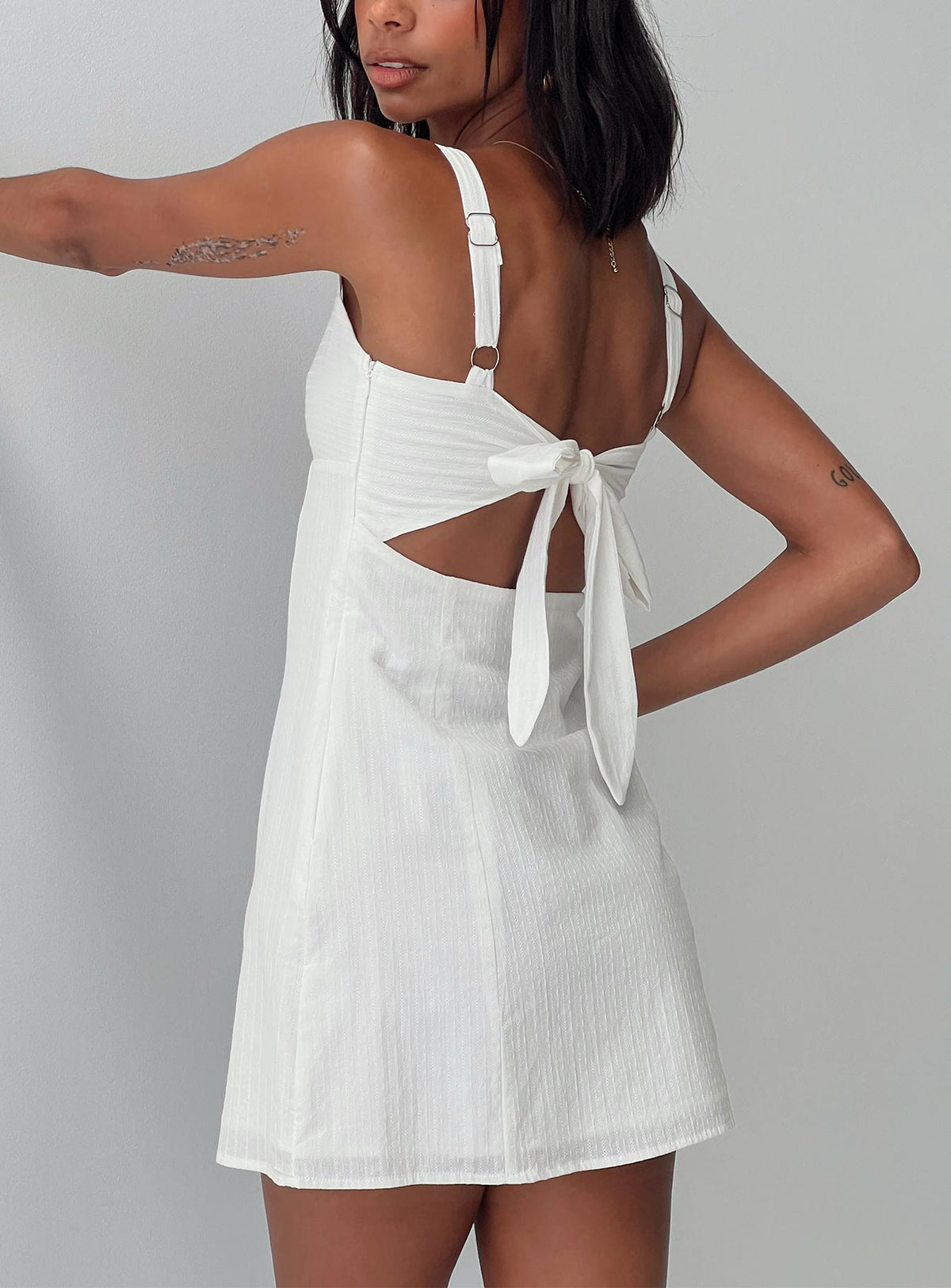 back view of model wearing Princess Polly Summer Isles Mini Dress White Sweetheart Neckline 