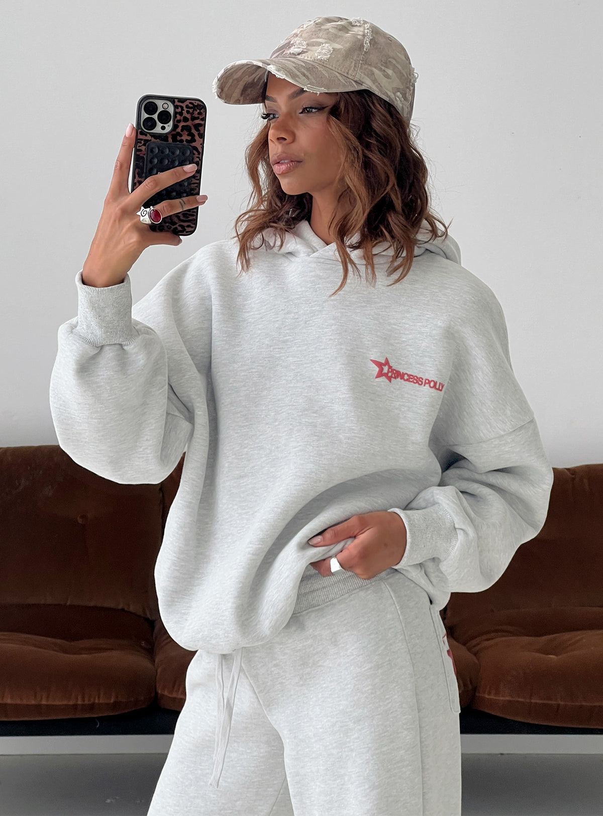 Showcasing the Stargirl Hoodie Grey Marle in womens jumpers with long length front view of model wearing Princess Polly
