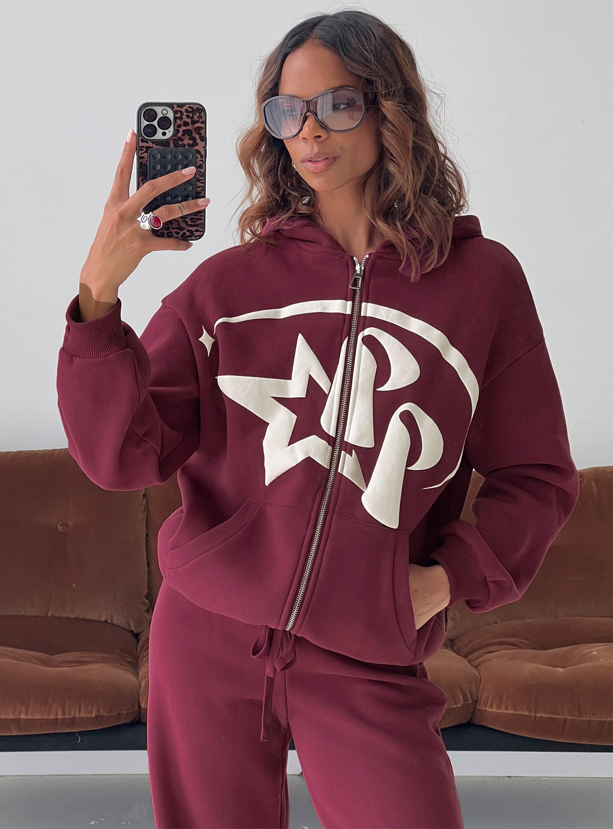Showcasing the Stargirl Zip Through Jumper in Burgundy womens jumpers with long fit front view of model wearing Princess Polly