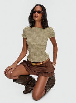 side view of model wearing Princess Polly Deei Double Ruffle Mini Skort Chocolate Low Rise Shorts 