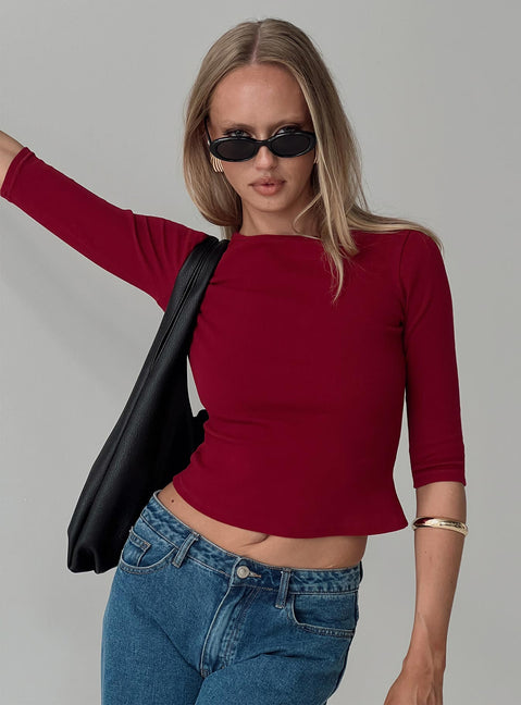 front view of model wearing Princess Polly Elaia 3/4 Sleeve Top Red Three Fourth Sleeves Crew Neck 