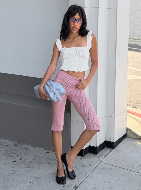 Showcasing Rossie Capri Pants Red Gingham womens-regular-pants with high-rise front view of model wearing