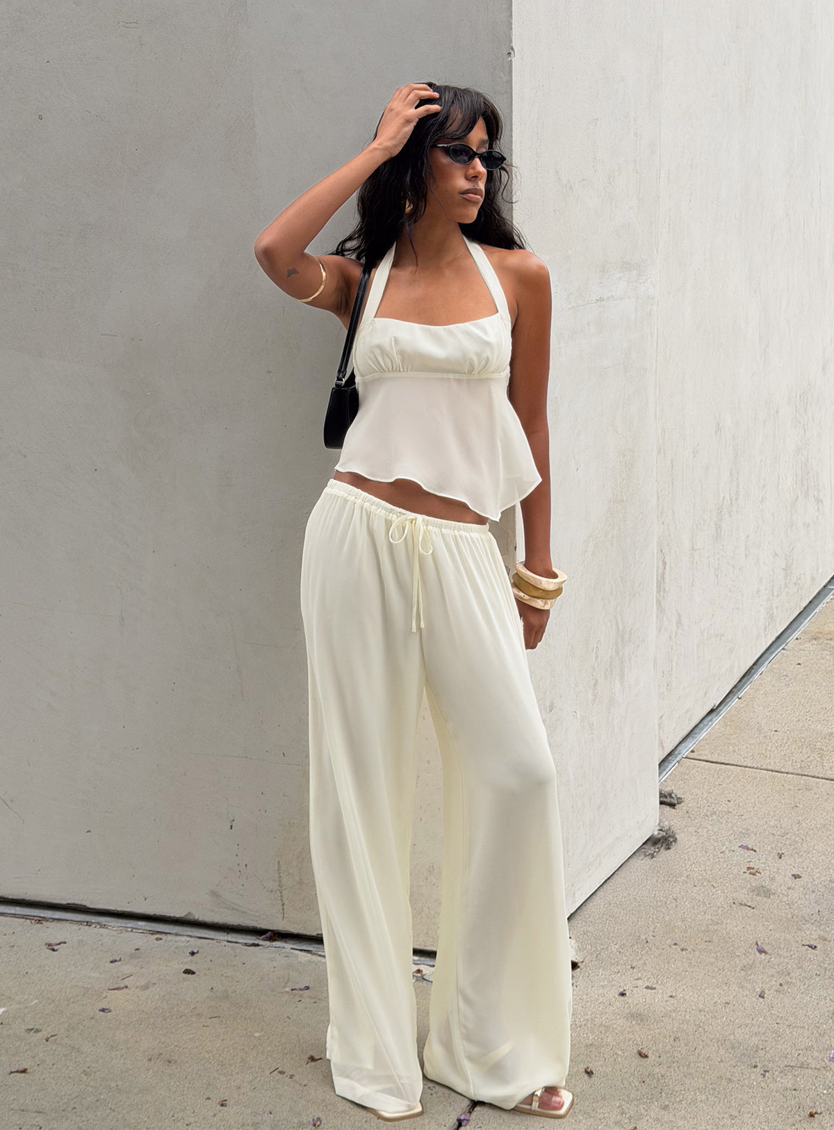 Showcasing the Finesse Pants Yellow womens-regular-pants with mid-rise front view of model wearing Princess Polly