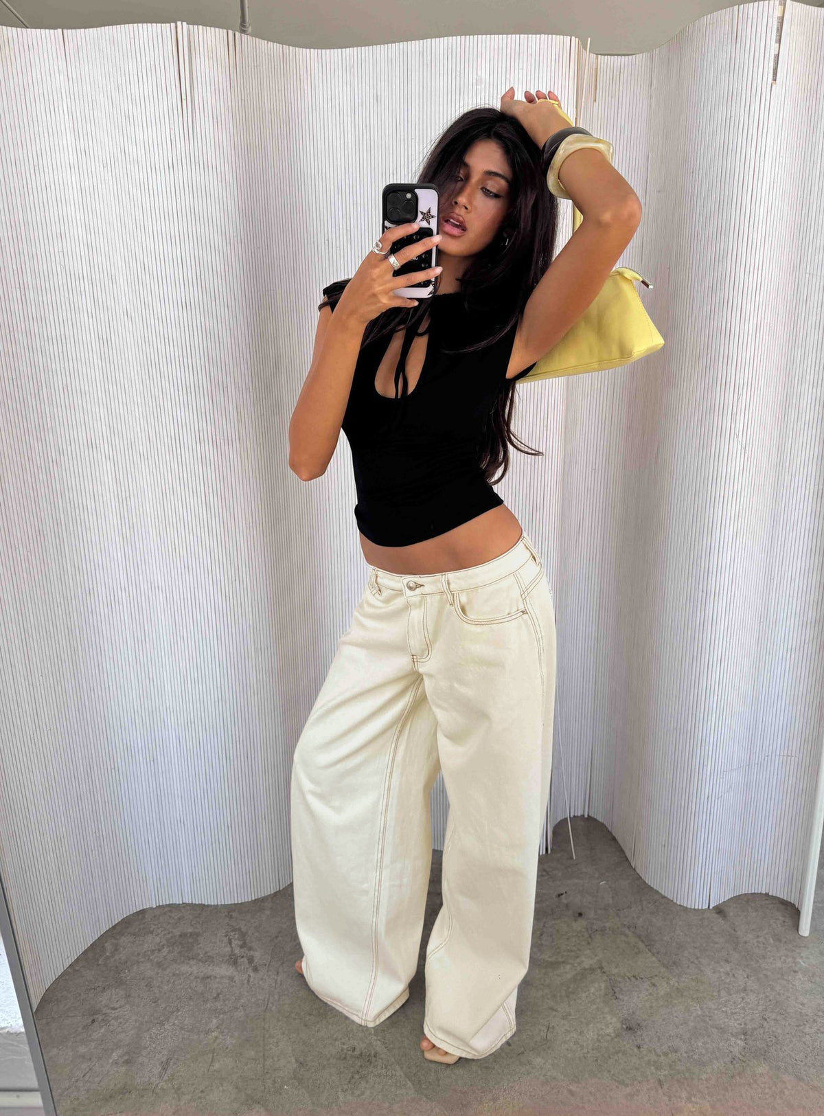 Discover the Ramos Low Rise Wide Leg Jeans in Cream front view of model wearing