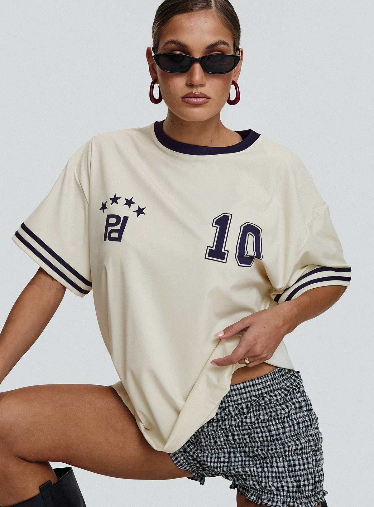 front view of model wearing Princess Polly Cornwall Football Jersey Cream Half Sleeves Crew Neck 