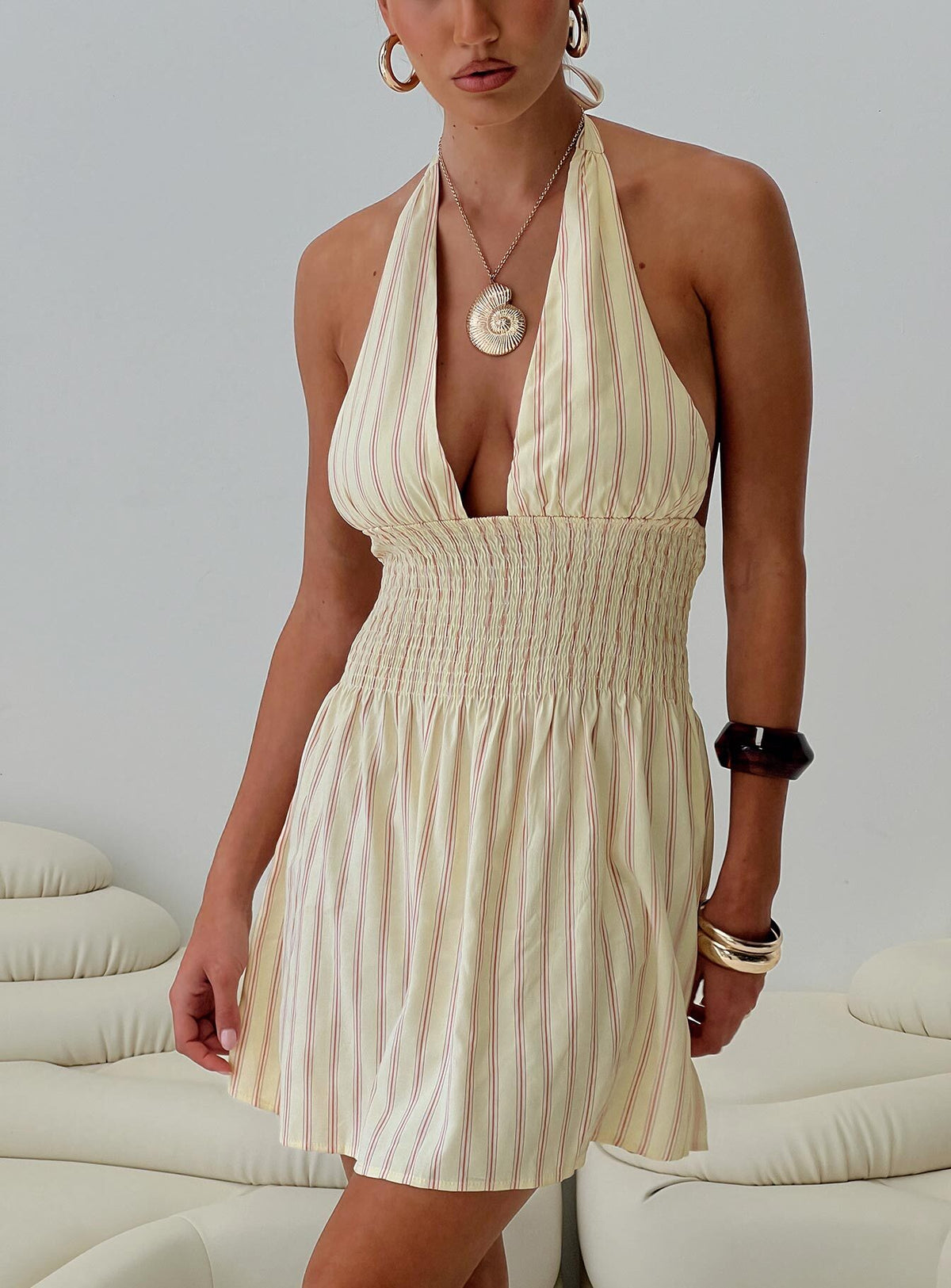 back view of model wearing Princess Polly Alivea Shirred Mini Dress Cream Plunger 