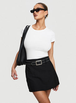 back view of model wearing Princess Polly Grant My Wish Mini Skort Black High Waisted Shorts 