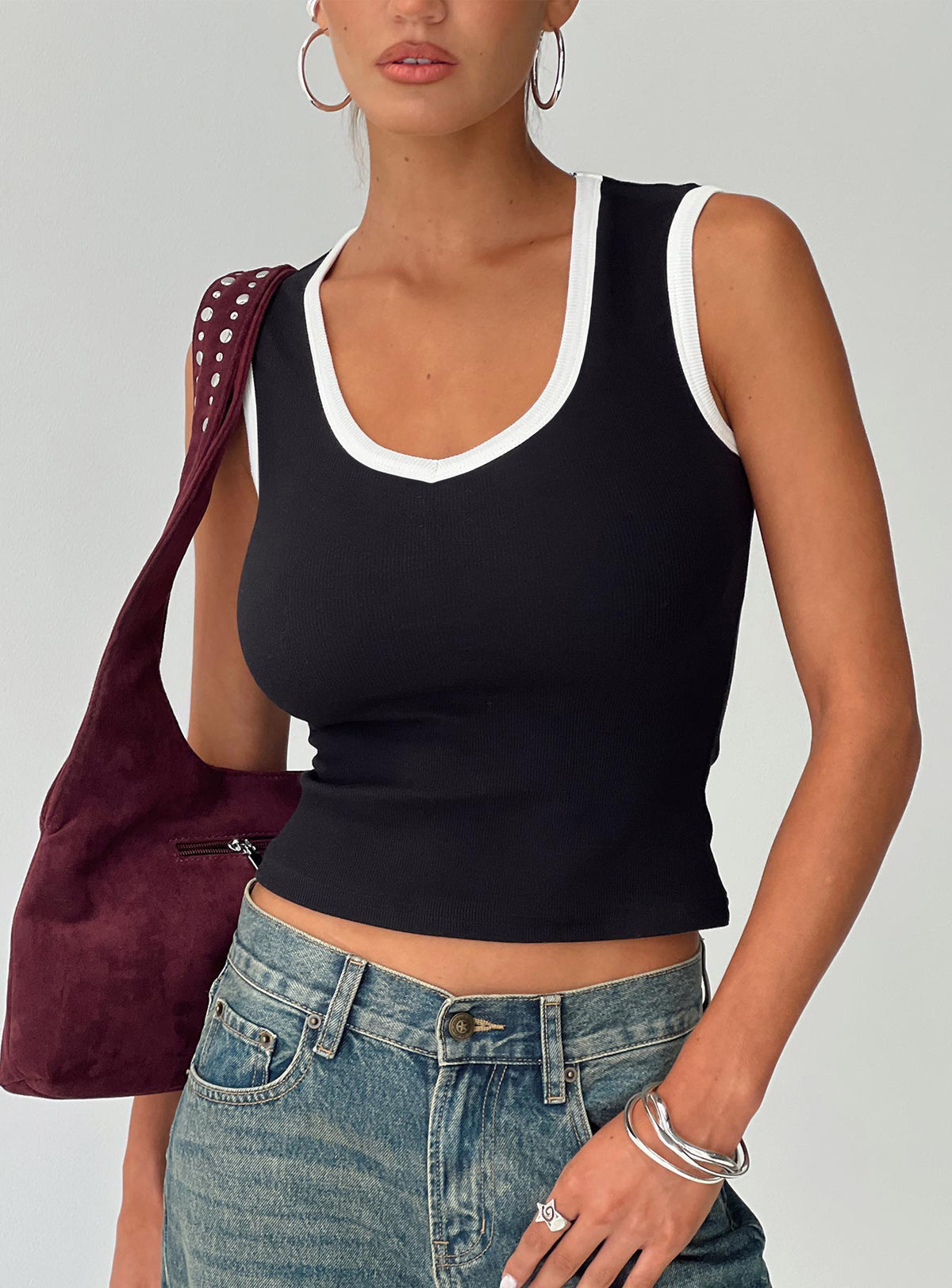 side view of model wearing Princess Polly Start Me Up Top Black / White Sleeveless Scoop Neck 