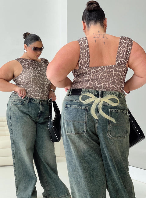 back view of model wearing Princess Polly Ribbon Stamp Low Rise Wide Leg Jeans Antique Wash Curve High Rise Jeans Jeans 