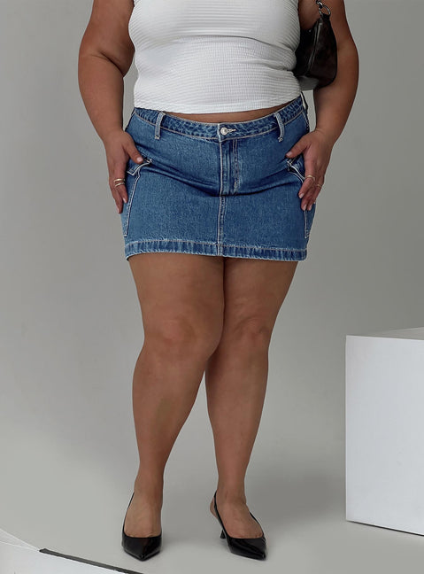   front view of model wearing Princess Polly Zakai Cargo Denim Mini Skirt Mid Blue Curve Mini Skirts Skirts 