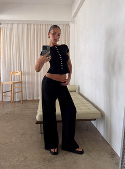 side view of model wearing Princess Polly Gavrielle Jersey Wide Leg Pants Black High Rise Pants Pants 