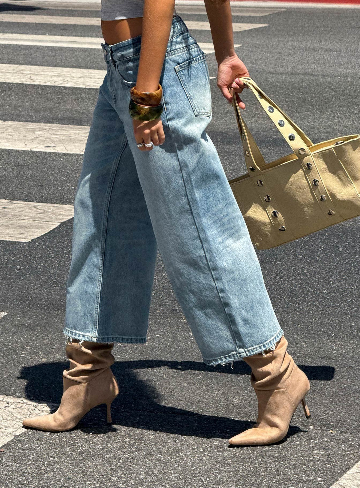 Showcasing Sooki Low Rise Cropped Jeans in Light Vintage Blue womens-jeans side view of model wearing Princess Polly
