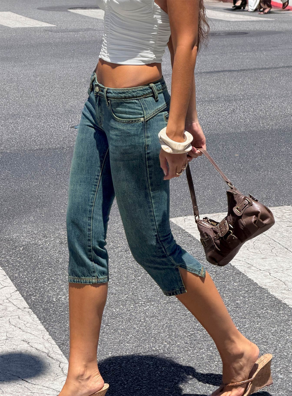 Discover the Ceilea Ultra Low Rise Denim Capri Pants Dirty Blue in womens regular pants with low-rise waist side view of model wearing Princess Polly