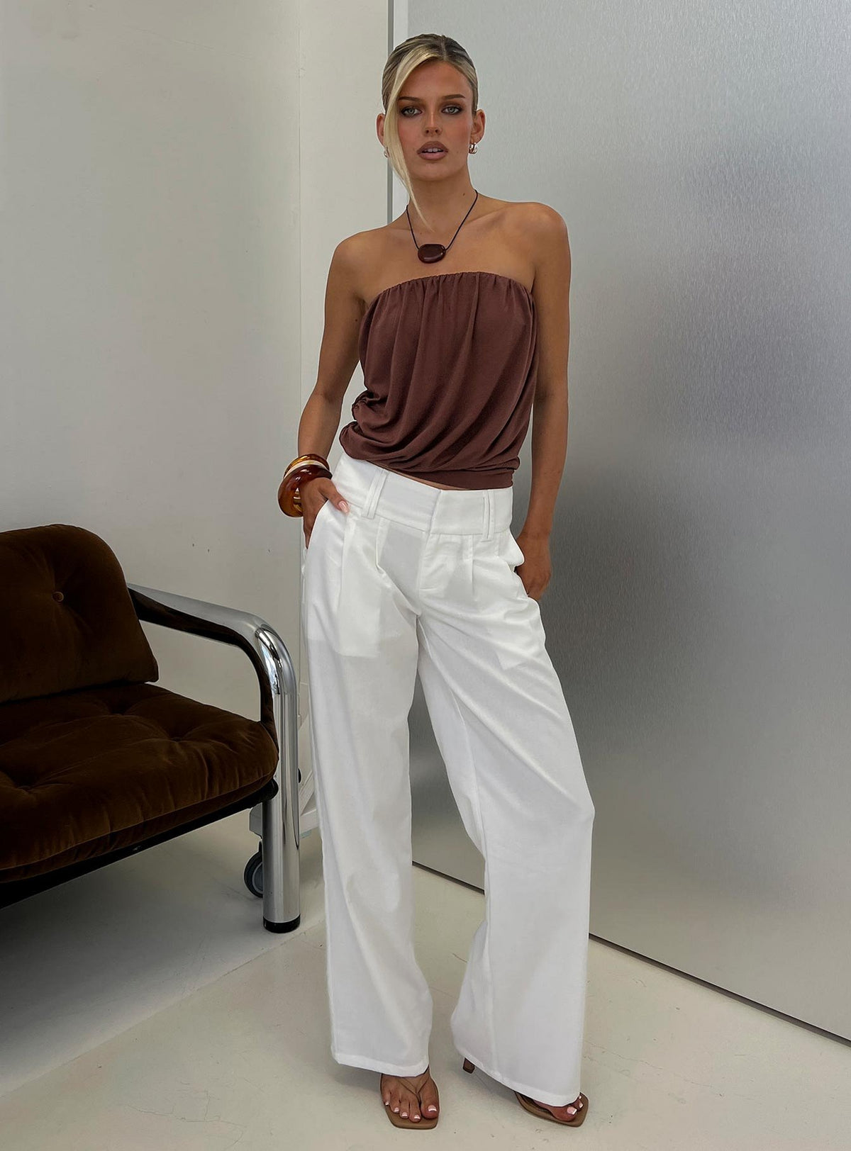 Showcasing the Two Lovers Linen Low Rise Pants White in womens regular pants, featuring low-rise waistband and wide-leg silhouette, front view of model wearing