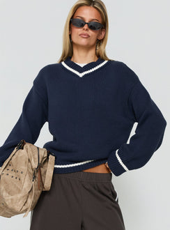 Showcasing the Myrandah V Neck Long Sleeve Knit Jumper Navy womens jumper with short length front view of model wearing Princess Polly