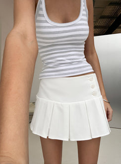 Showcasing the Raynah Micro Pleated Mini Skort White in womens-skirts with mini length, solid, a-line shape, and fitted silhouette front view of model wearing Princess Polly