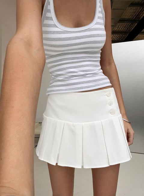 Showcasing the Raynah Micro Pleated Mini Skort White in womens-skirts with mini length, solid, a-line shape, and fitted silhouette front view of model wearing Princess Polly