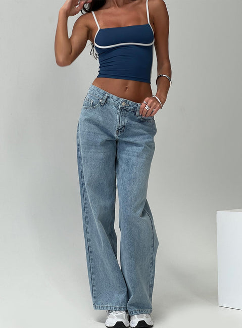 front view of model wearing Princess Polly Serenitia Mid Rise Relaxed Jeans Light Wash Petite Mid Rise 