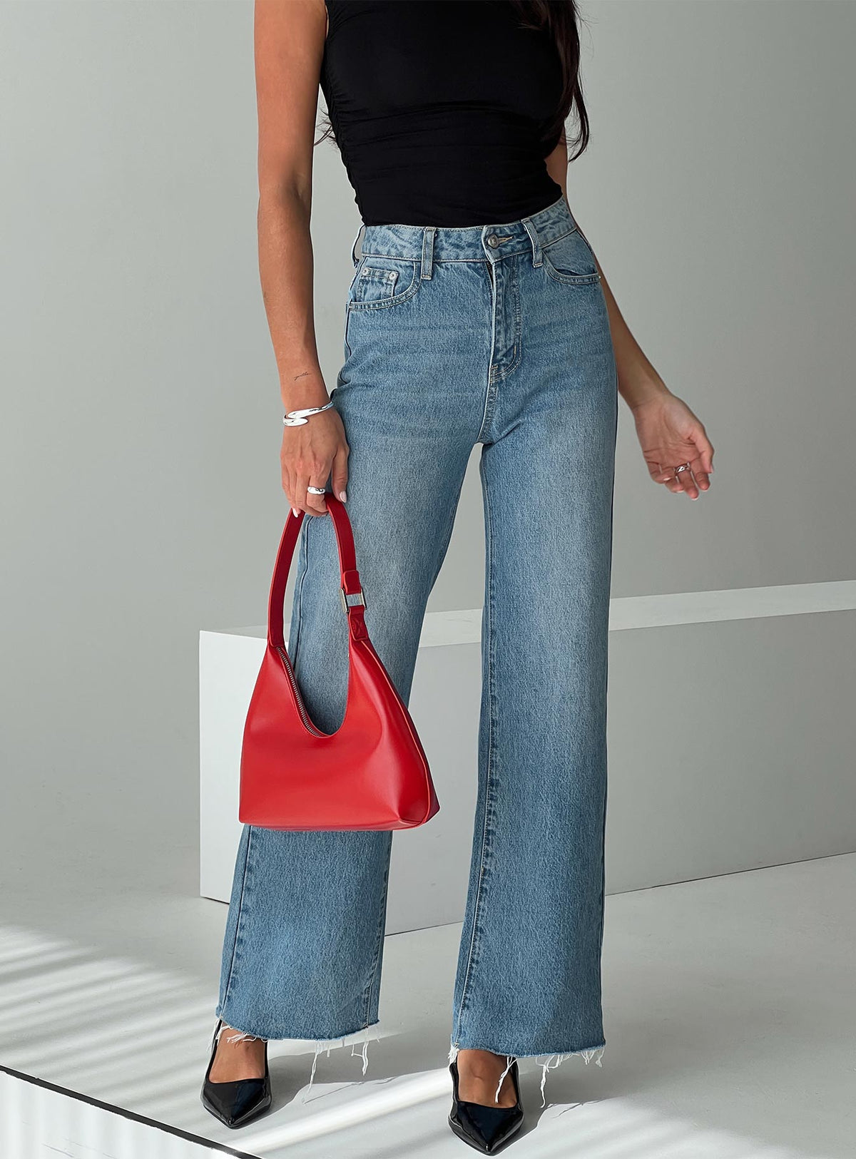 back view of model wearing Princess Polly Henesey High Rise Straight Leg Jeans Mid Blue Wash High Rise Jeans Jeans 