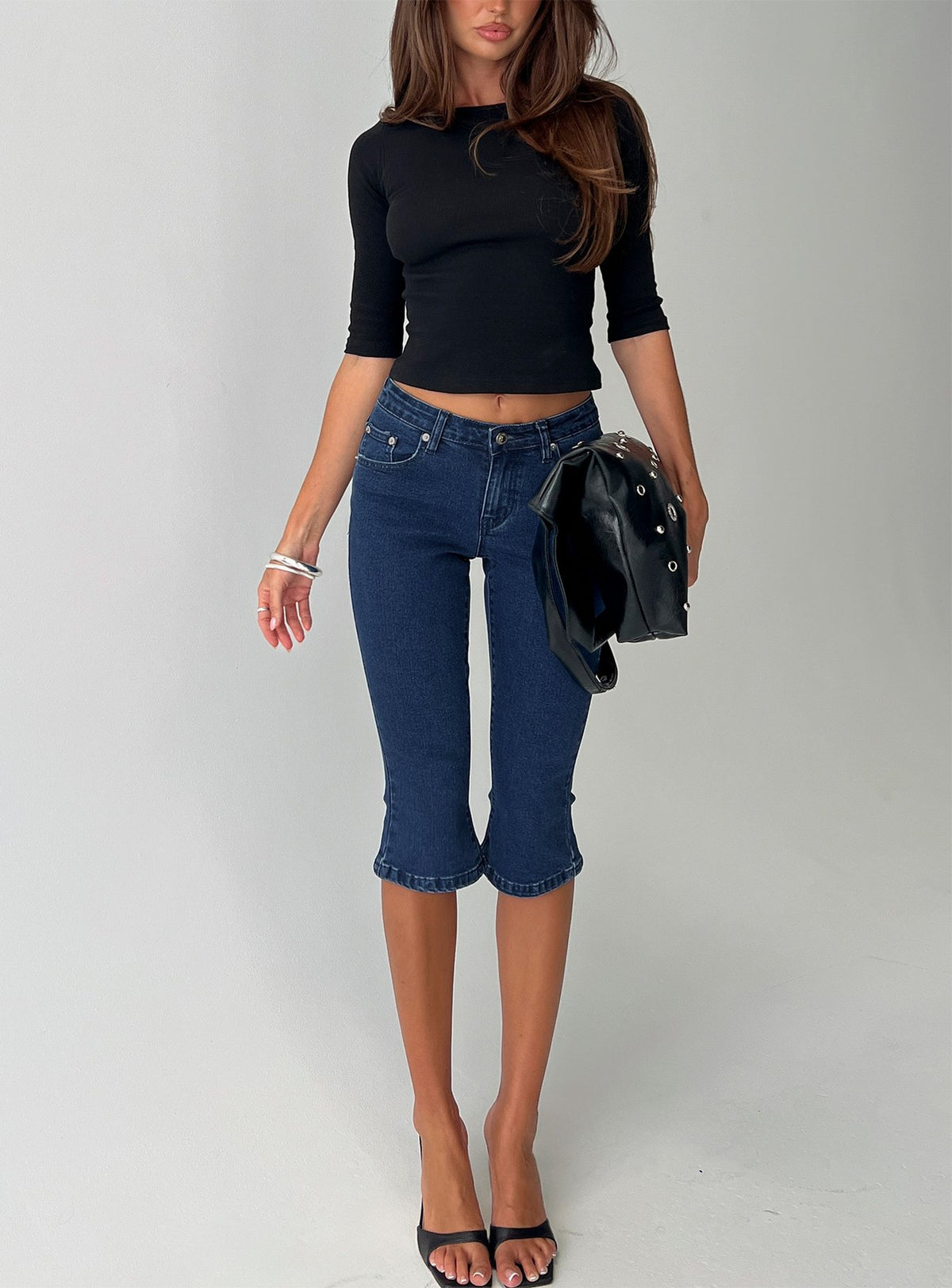 front view of model wearing Princess Polly Kissimo Kick Flare Capri Pants Indigo Blue Mid Rise Jeans Jeans 