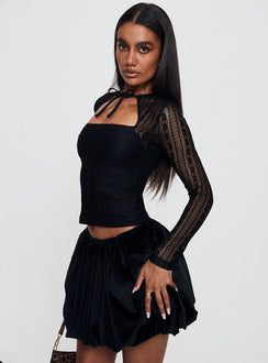   side view of model wearing Princess Polly Georgiana Bubble Hem Mini Skirt Black Mini Skirts Skirts 