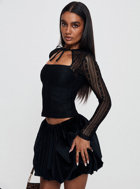   side view of model wearing Princess Polly Georgiana Bubble Hem Mini Skirt Black Mini Skirts Skirts 