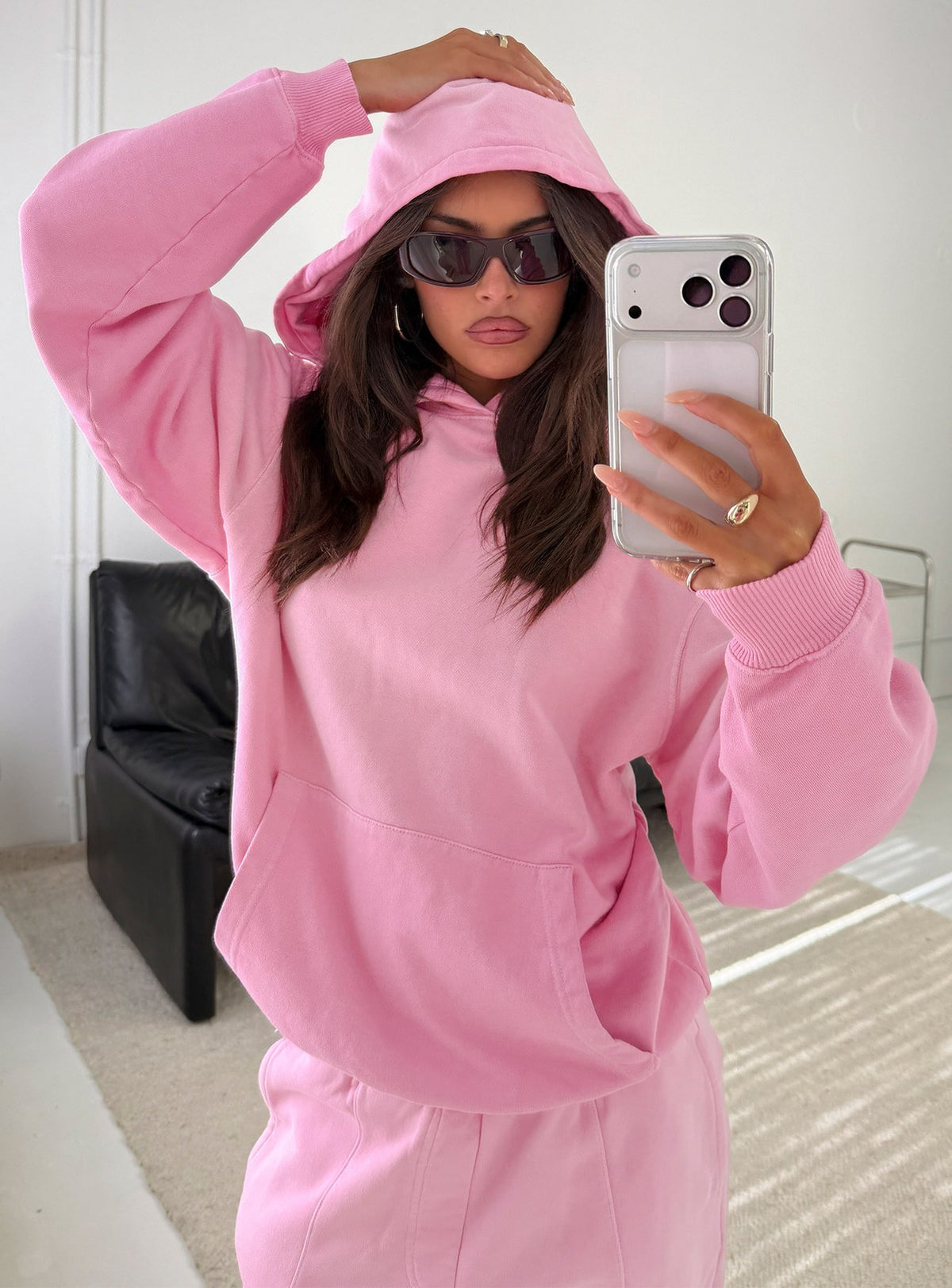 Showcasing the AT Pullover Oversized Hoodie in Washed Pink womens-jumpers with long length and hooded neckline front view of model wearing Princess Polly