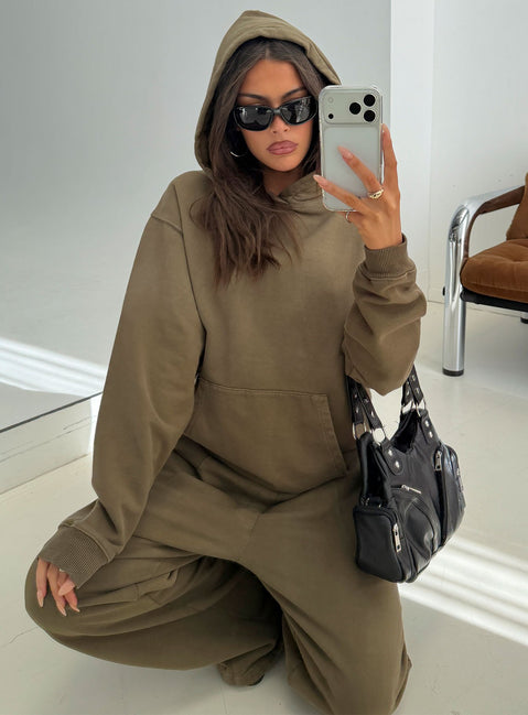 Showcasing the AT Pullover Oversized Hoodie Washed Olive in womens-jumpers with long fit detail view of model wearing Princess Polly