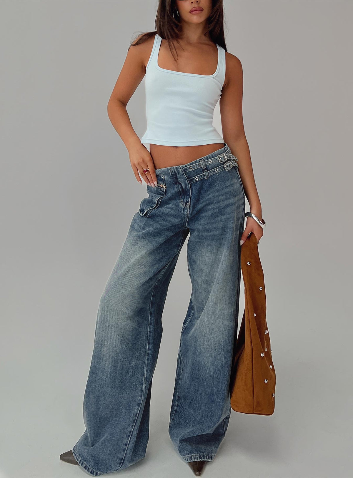 front view of model wearing Princess Polly Paltrow Mid Rise Wide Leg Cargo Jeans Mid Blue Wash Petite Mid Rise Jeans 