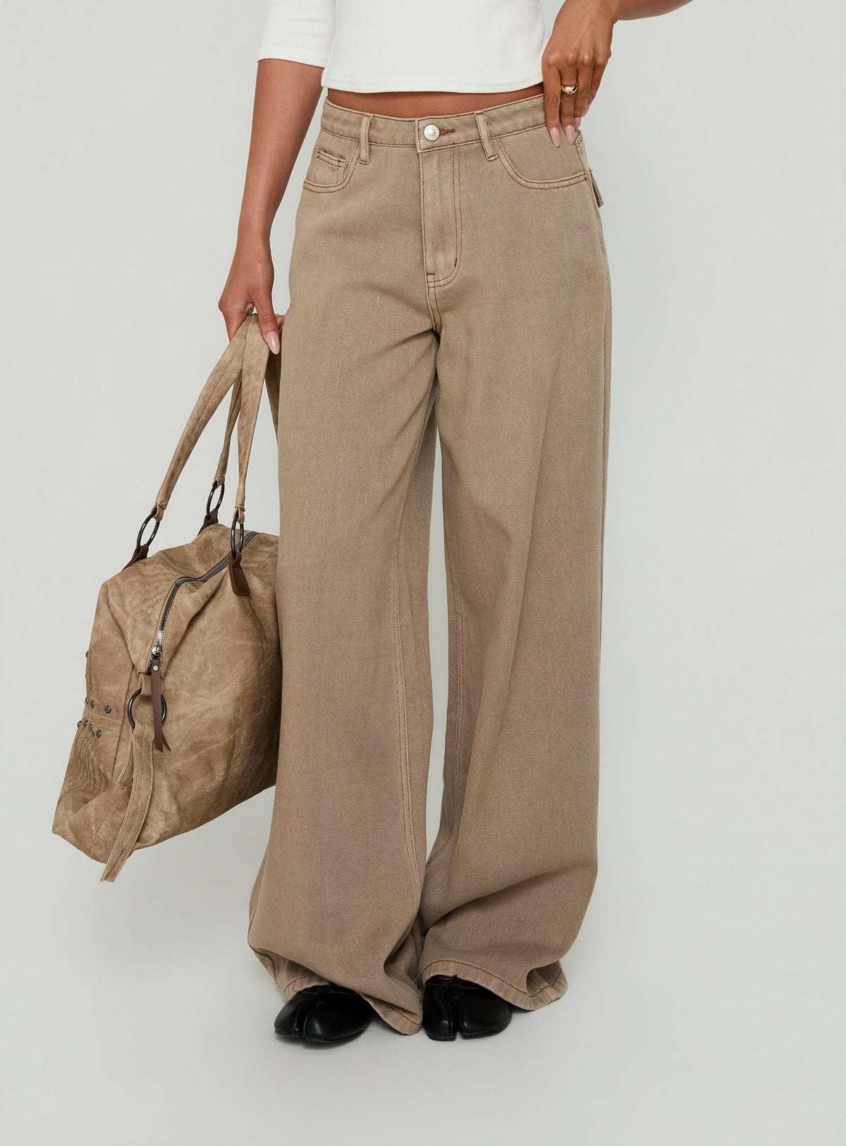 Showcasing the Maryjo Mid Rise Super Baggy Jeans Washed Brown in womens-jeans with mid-rise waist front view of model wearing Princess Polly