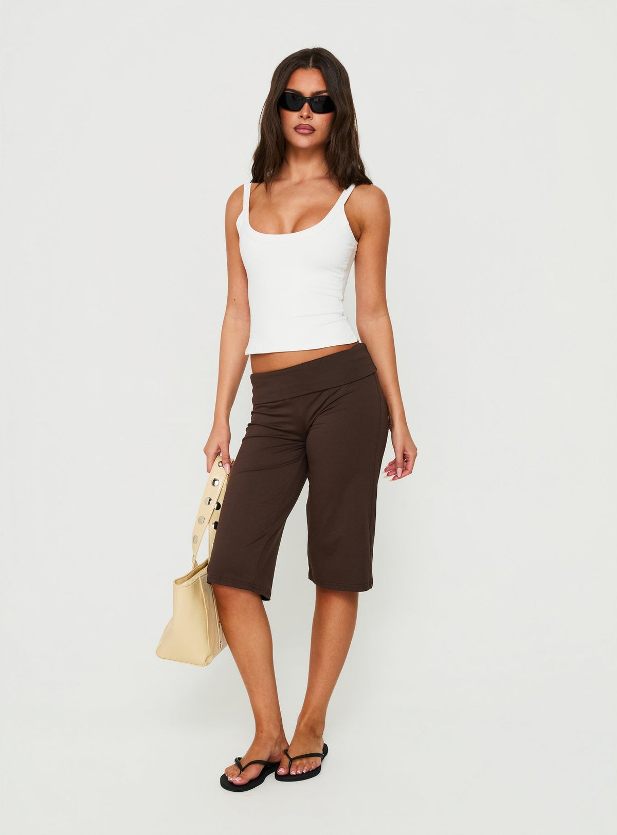 Showcasing the Laroy Folded Capri Pant Chocolate in womens regular pants with high-rise waist front view of model wearing