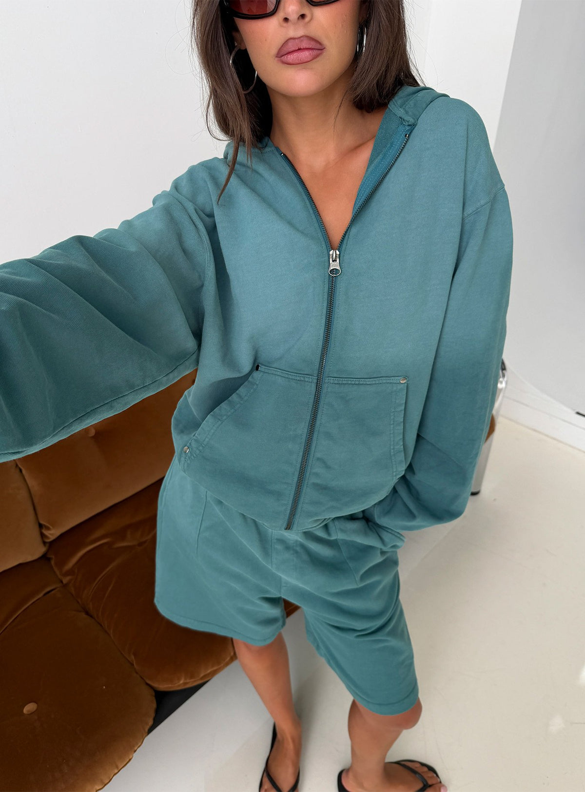 Discover the AT Zip Through Oversized Hoodie in Washed Teal womens-jumpers with short length detail view of model wearing Princess Polly