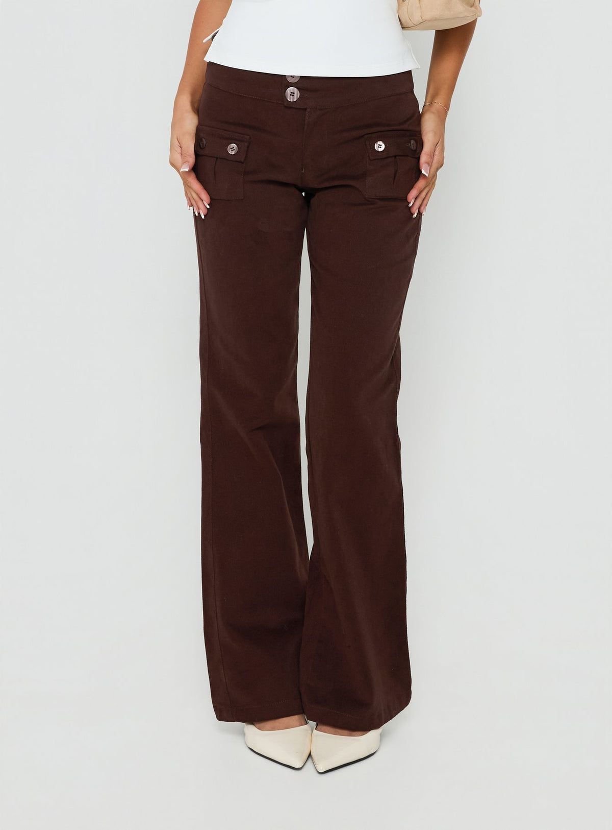 Showcasing Vanla Trouser Brown womens-regular-pants with high-rise waist and wide-leg silhouette front view of model wearing Princess Polly