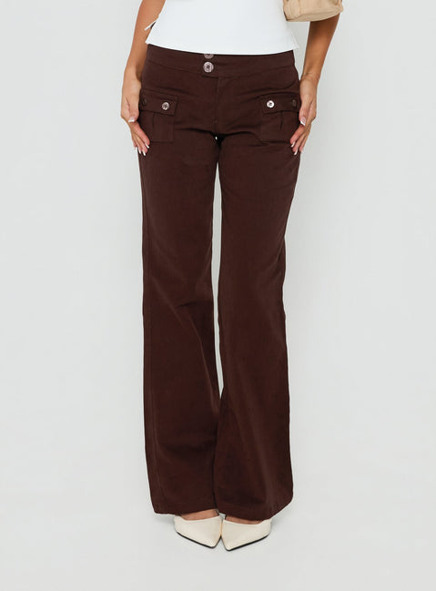Showcasing Vanla Trouser Brown womens-regular-pants with high-rise waist and wide-leg silhouette front view of model wearing Princess Polly